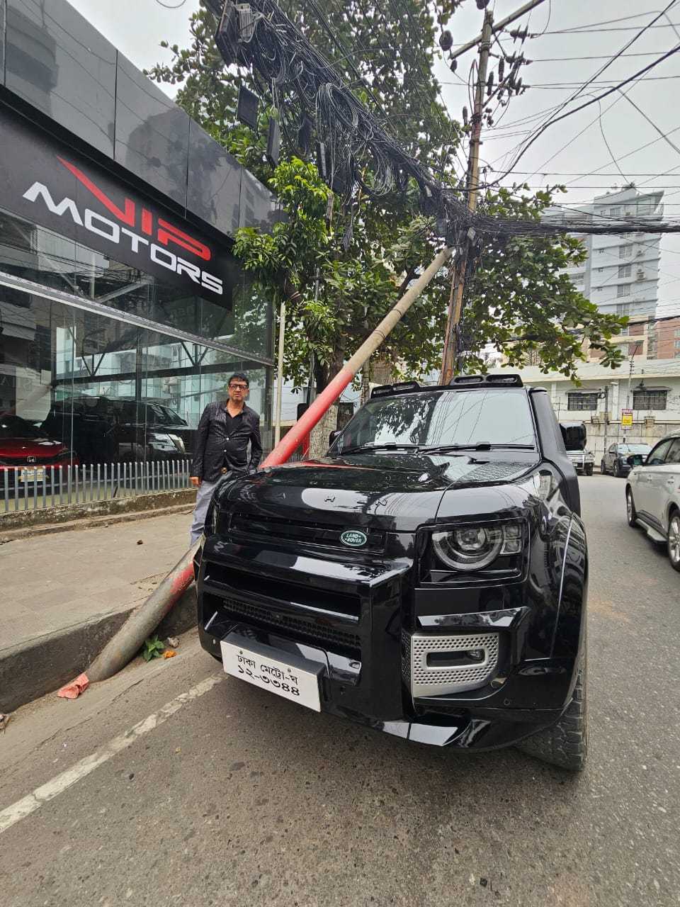 A Land Rover Defender parked outside the VIP Motors showroom in Dhaka.